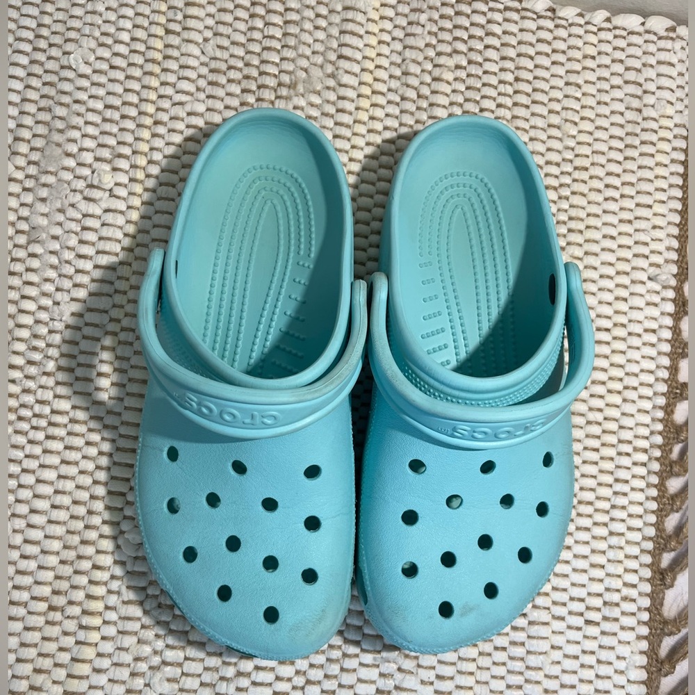 Crocs Unisex-Adult Classic Clogs. Color is classic water. Size is W10 M8.